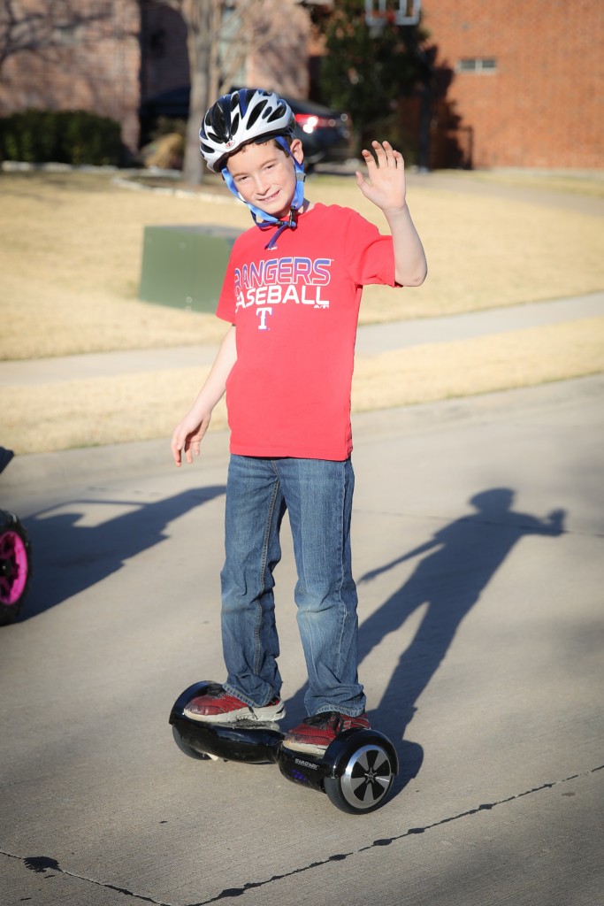 Here's my boy - - cruisin' up and down the street on his hoverboard! 