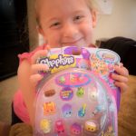 This is one happy girl! A new pack of Shopkins!!