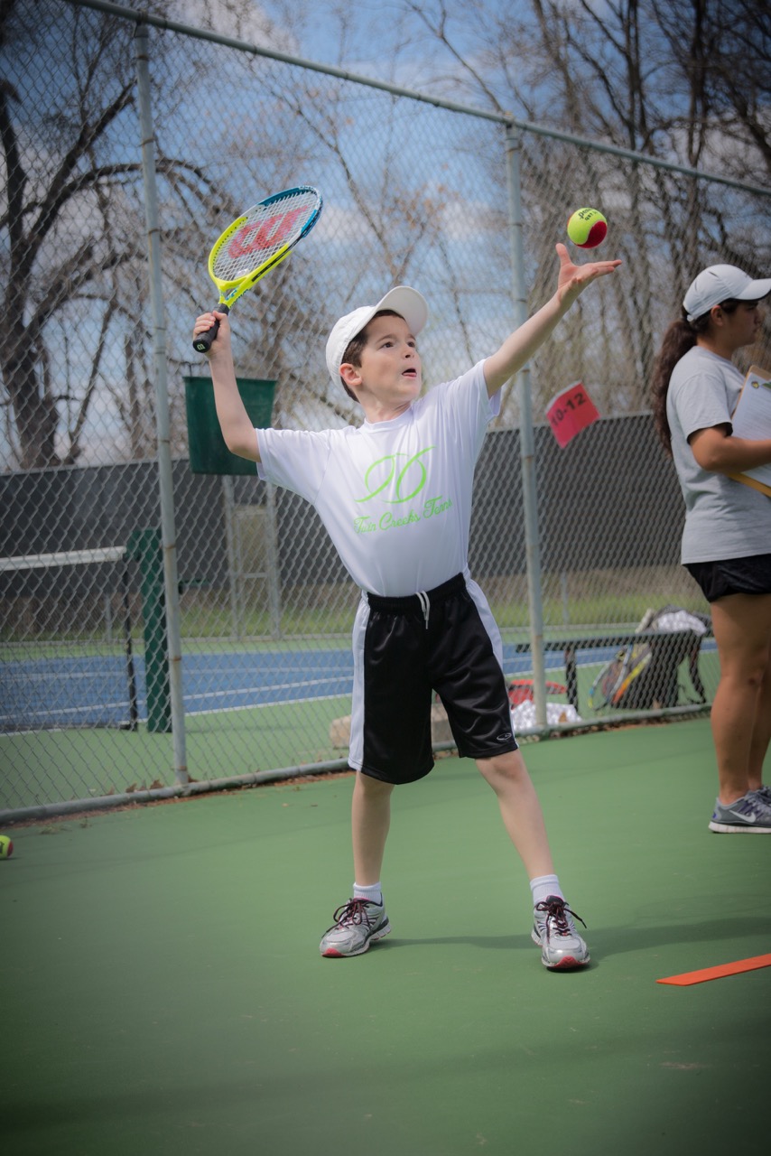 Shooting Through a Chain-Link Fence at a Tennis Match…